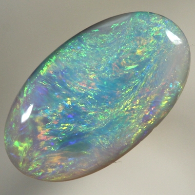 SOLID SEMI BLACK OPAL Bright sparkling colours moving over turquoise blue 